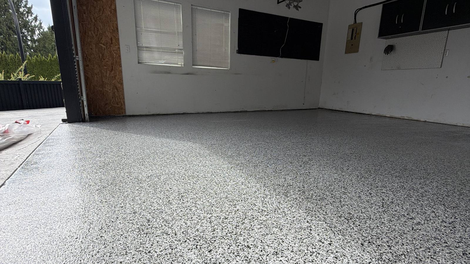 Finished decorative flake epoxy garage floor in Coquitlam, full bay coated