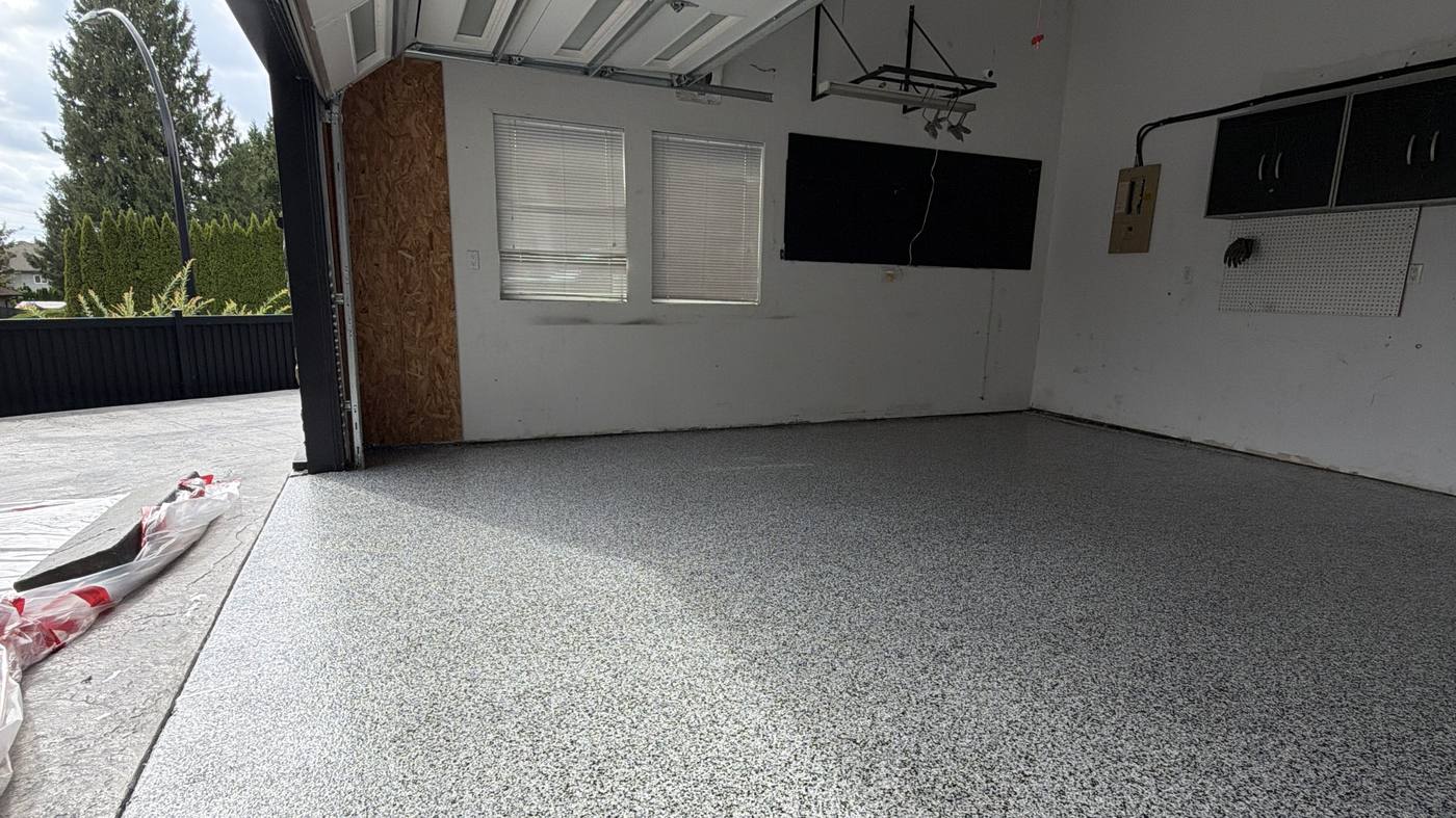 Completed decorative flake garage floor coating covering the full bay